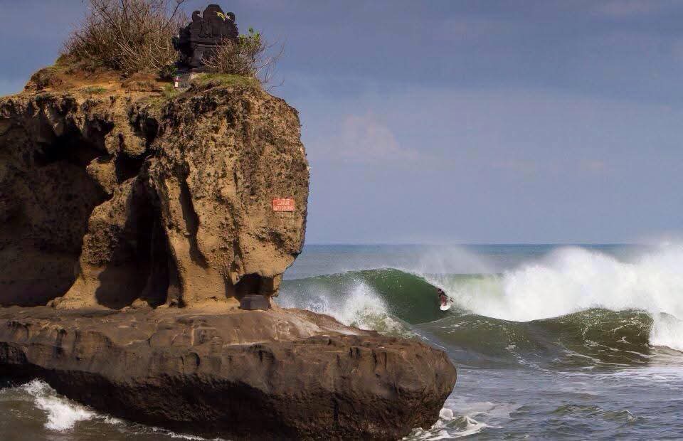 Beginner surfer catching a wave