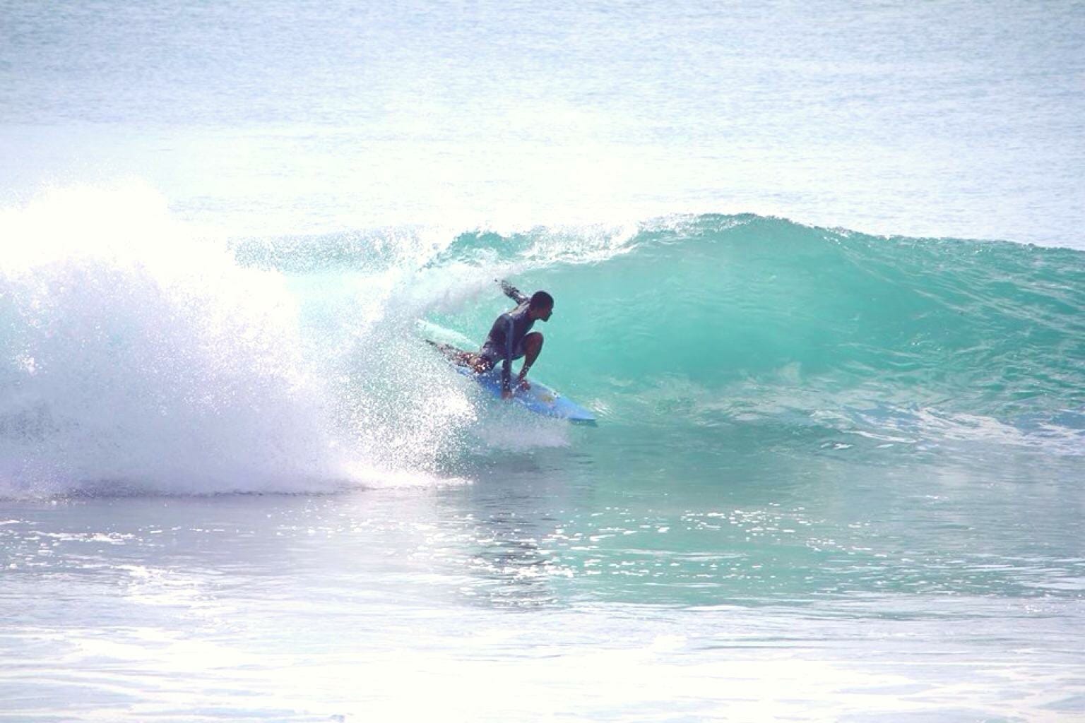 Intermediate surfer riding a wave