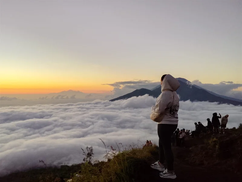 Trekkers enjoying mountain sunrise